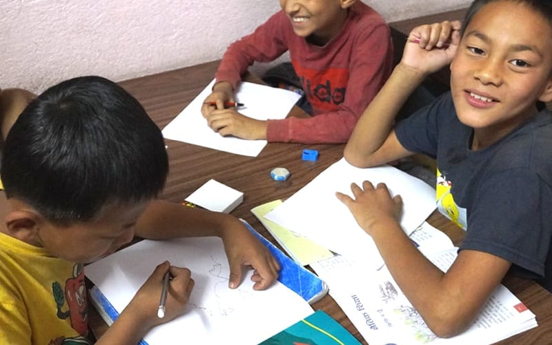 Children learning in a classroom at Shining Hill